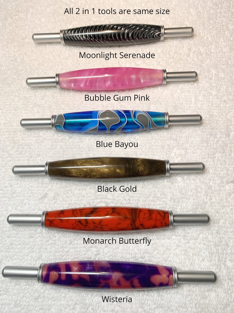 May include: Six 2-in-1 tools with silver metal ends and patterned barrels labeled Moonlight Serenade, Bubble Gum Pink, Blue Bayou, Black Gold, Monarch Butterfly, and Wisteria. The text states: All 2 in 1 tools are same size.