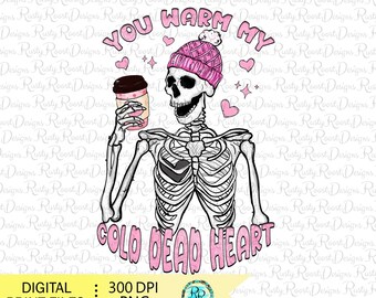 May include: A skeleton wearing a pink knit hat with a white pom pom holds a cup of coffee and smiles. The text "You warm my cold dead heart" is written in pink letters below the skeleton.