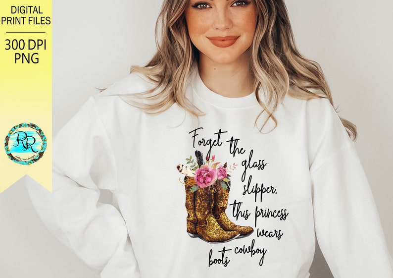 May include: White sweatshirt with a graphic of cowboy boots and the text "Forget the glass slipper, this princess wears cowboy boots."