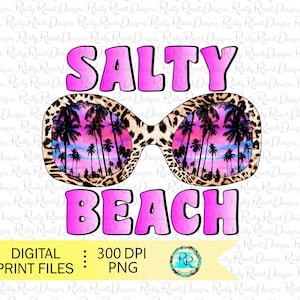 May include: Pink graphic with the text "SALTY BEACH" in a bold font. The graphic features a pair of sunglasses with a leopard print frame and a sunset scene reflected in the lenses.
