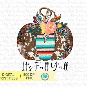 May include: A brown and white cow print pumpkin with turquoise, orange, and red stripes. The pumpkin is decorated with a floral arrangement of pink, white, and yellow flowers. The text "It's Fall Y'all" is written below the pumpkin.