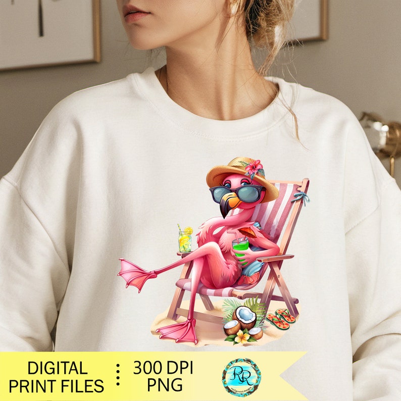 May include: Cream-colored sweatshirt featuring a cartoon flamingo relaxing in a beach chair, wearing sunglasses and a hat. The flamingo holds a drink, with coconuts and flip-flops nearby. The text "DIGITAL PRINT FILES : PNG" is at the bottom.