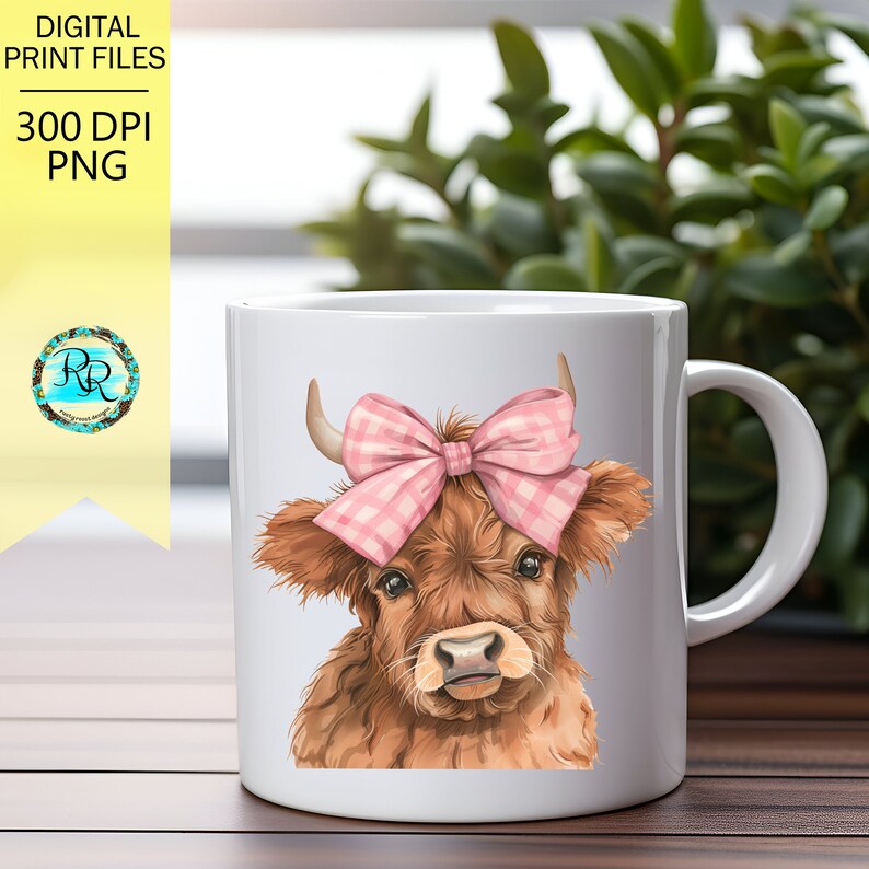 May include: White ceramic mug with a brown and white Highland cow with a pink and white gingham bow on its head. The cow is looking at the viewer.