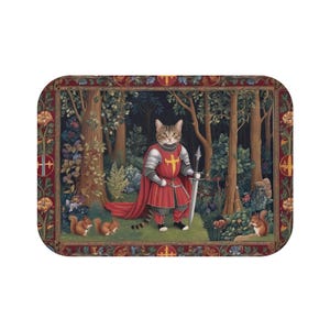May include: A tapestry-style illustration of a cat dressed as a knight in red armor, holding a sword. The cat is standing in a forest setting with two squirrels on either side. The tapestry has a gold and red border.