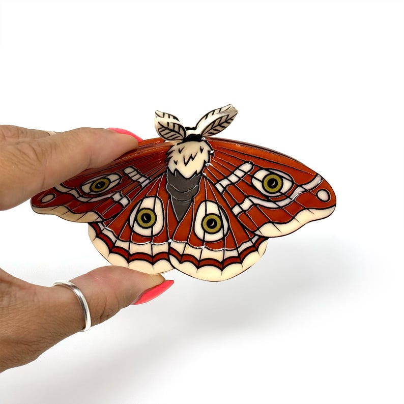 "Stylish Lunar and Death's Head Moth hair clip with bold, detailed wings and dark, elegant design."