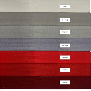 May include: A swatch card showing ten different fabric colors. The colors are: Silver, Med Greige, Elephant, Gray matter, Deep Red, Ruby, and Sharaz.