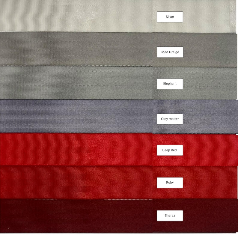 May include: A swatch card showing ten different fabric colors. The colors are: Silver, Med Greige, Elephant, Gray matter, Deep Red, Ruby, and Sharaz.
