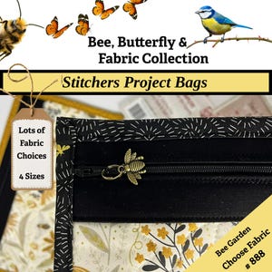 May include: A black and white fabric project bag with a bee zipper pull. The bag has a black zipper and a tag that says "Lots of Fabric Choices" and "4 Sizes". The bag is part of the "Bee, Butterfly & Fabric Collection".