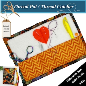May include: A rectangular thread catcher with a white interior, orange chevron pocket, and a Halloween-themed border. The design includes an orange heart, needles, scissors, and the text "Thread Pal / Thread Catcher". The tag reads "Lots of Fabric Choices".