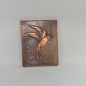 Vintage brass wall plaque of a bird