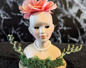 Ilumina cabezas de muñecas bebé con flores