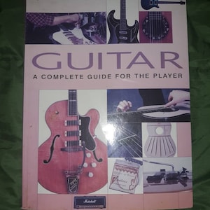 Two Guitar Books and Two Tuners and Picks