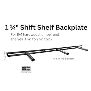 May include: Black metal Shift Shelf Backplate with three cylindrical supports. The backplate is 3.18 cm wide and designed for hardwood lumber and shelves 4.45 cm to 6.35 cm thick. The rod diameter is 1.9 cm. Made in the USA.