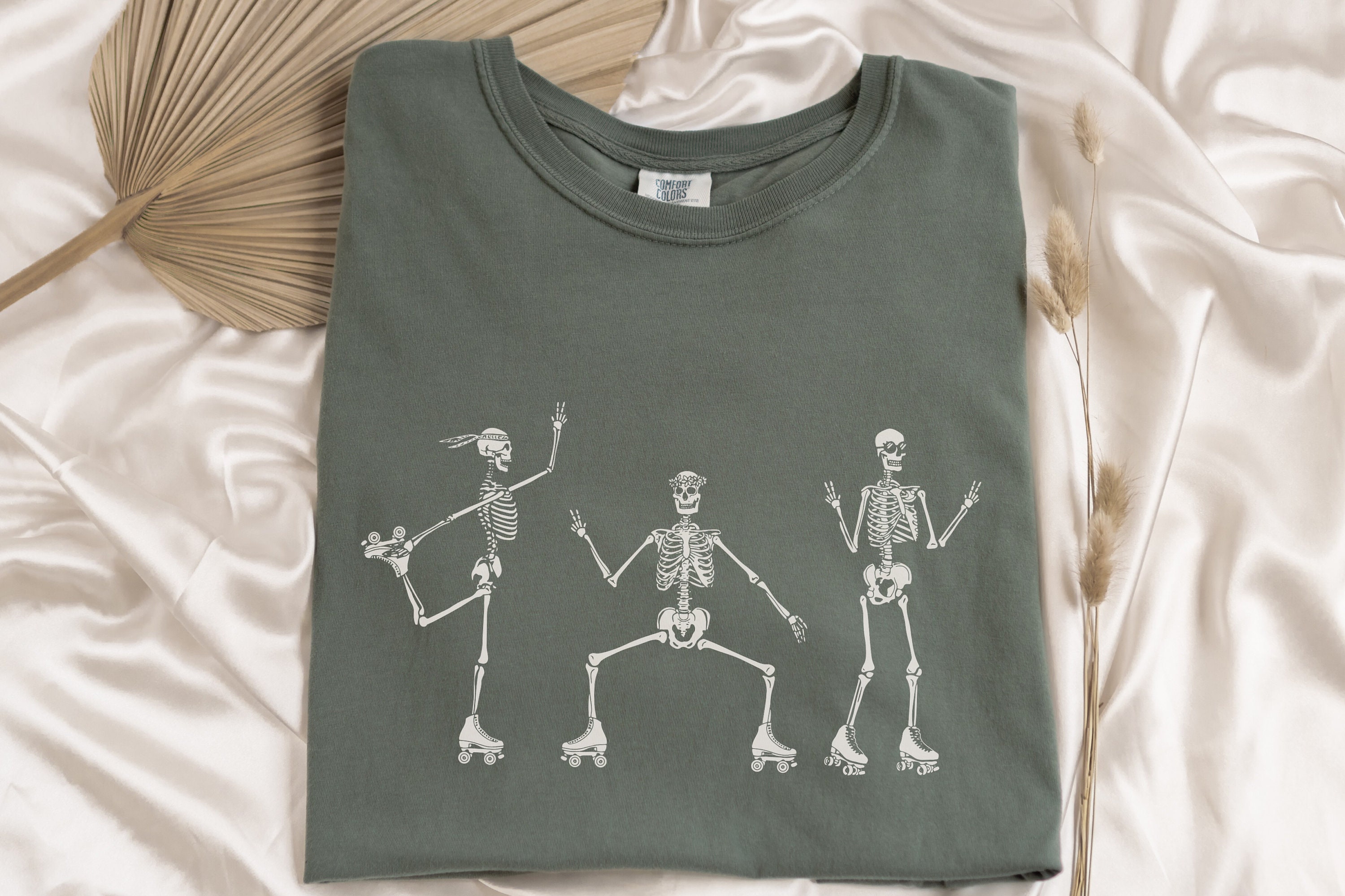 Discover Roller Skating Skeletons T-Shirt - Cozy Fall Tee, Vintage Look and Feel Oversized Shirt for Halloween