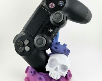 Suporte para controle de ps4 com tentáculo multicolorido rosa roxo e azul com uma caveira sala de jogos
