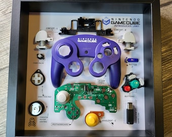 Moldura para exibição de controle de Gamecube, estilo caixa de sombra, perfeita para jogos retrô, ideal para gamers e colecionadores, decoração de parede, arte para fãs e sala de jogos.