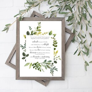 May include: A framed print with a white background and green watercolor leaves. The text reads: "The new home centered, Church supported integrated curriculum has the potential to unleash the power of families to make Sabbath days a true delight. Help your children learn the Savior's teachings. Help your children live the Savior's teachings. Decrease the influence of the adversary in your life and home. Make dramatic and sustaining changes in your family."