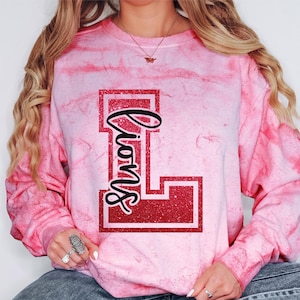 Custom Lions Spirit Wear on Comfort Colors Color Blast t-shirts & sweatshirts with name and number on the back.