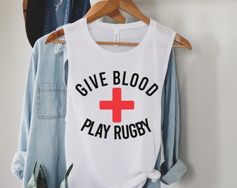 Give blood play rugby on ladies Bella Canvas muscle tank tops.