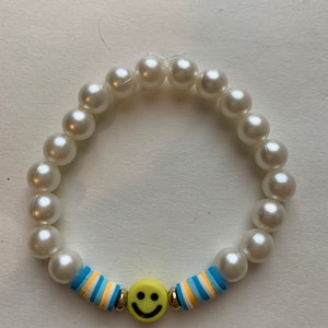 Blue pearly and yellow smile face bracelet