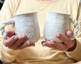 Set of 2 white Handmade ceramic coffee mugs with swirl texture and twisted handles