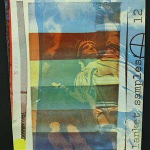 May include: A vintage poster with a colorful image of the Statue of Liberty. The poster is printed on a textured paper and has a distressed look. The text "blanket samples 12" is printed on the right side of the poster.