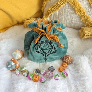 Multi pocket dice bag in green. Transportable dice storage for TTRPG dice and miniatures. Druid inspired embroidered dice bag