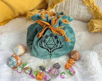 Multi pocket dice bag in green. Transportable dice storage for TTRPG dice and miniatures. Druid inspired embroidered dice bag