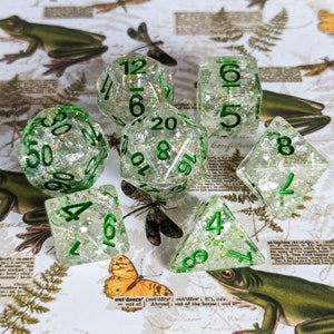 Serpent DnD 7pc Dice Set, Polyhedral D&D dice, Dungeons and Dragons, TTRPG. Clear Resin with Opal Flake Glitter, Silver Foil, Green Font