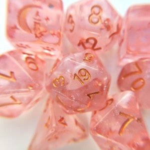 Sakura Cloud Dice Set, TTRPG Polyhedral dice, D&D dice, Dungeons and Dragons, Table Top Role Playing. Pink clear resin with copper font