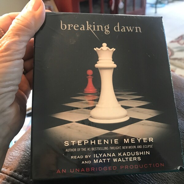 Breaking Dawn by Stephenie Meyer,excellent condition,package never opened,listening library,20 hours and 29 minutes