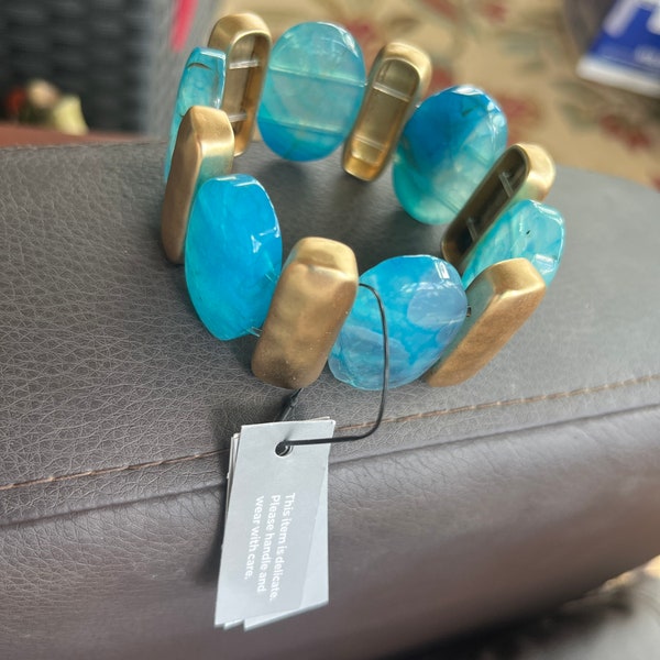 Beautiful blue and gold bracelet,one size fits all,excellent condition,new,on sale now,was 49.50 now 24.75  now 10.00