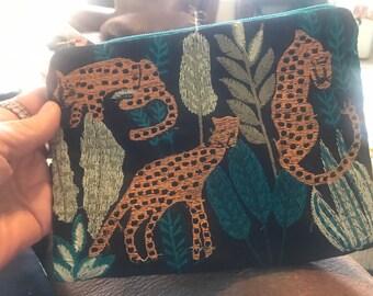 Beautiful cosmetic bag,colorful animals and plants,new never used,measures 6x8”,divider inside