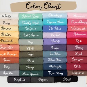 May include: A color chart displays a variety of fabric colors, including white, ivory, and black. The chart includes the text "Color Chart" in cursive script. The colors are arranged in rows and columns, with each color labeled with its name.