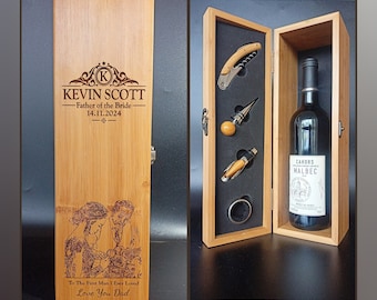 May include: A wooden wine box with a personalized inscription for Kevin Scott, Father of the Bride, with the date 14.11.2024. The box includes a bottle of Cahors Malbec wine, a corkscrew, a bottle stopper, and a ring pull.