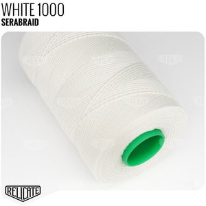 May include: A white spool of 1000 meter Serabraid thread with a green plastic end cap.