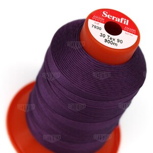 May include: A spool of purple thread labeled "Serafil" with the brand name "Amann Group" and the text "Col 7930 30 Tex 90 900m".