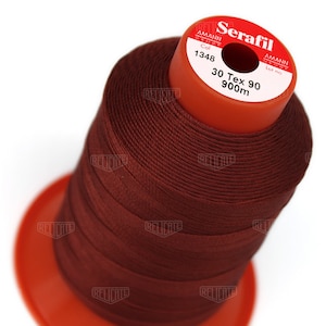 May include: A spool of brown thread labeled "Serafil 30 Tex 90 900m" with the Amann Group logo and color code 1348.