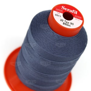 May include: A spool of dark blue thread labeled "Serafil" with the brand name "Amann Group" and the details "Col 0311", "30 Tex 90", and "900m".