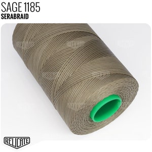 May include: A spool of brown thread with a green plastic end cap. The label on the spool reads "SAGE 1185 SERABRAID".