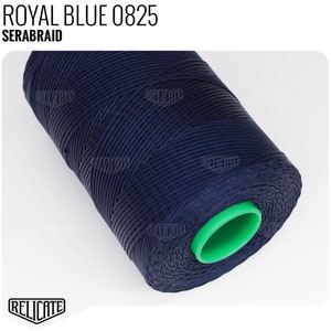 May include: A spool of dark blue thread with a green plastic end cap. The label on the spool reads "ROYAL BLUE 0825 SERABRAID".