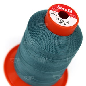 May include: A spool of teal-colored thread labeled "Serafil" with the brand name "Amann Group" and the text "Col 0359 30 Tex 90 900m".