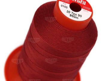 May include: A spool of red thread labeled "Serafil" by Amann Group. The spool is labeled "Col 0105", "30 Tex 90", and "900m".