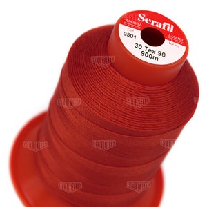 May include: A spool of red thread labeled "Serafil" with the brand name "Amann Group" and the details "Col 0501", "30 Tex 90", and "900m".