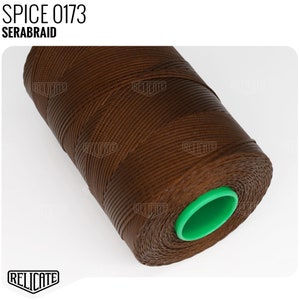 May include: A spool of brown waxed thread with a green plastic end cap. The label on the spool reads "SPICE 0173 SERABRAID".