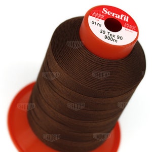 May include: A brown spool of Serafil thread with the text "Serafil", "Amann Group", "Col 0175", "30 Tex 90", and "900m" printed on the label.