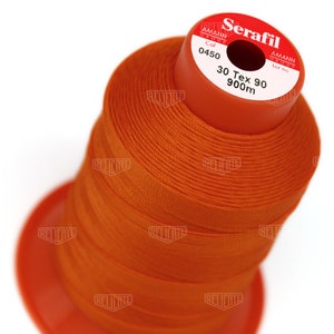May include: Orange spool of Serafil thread with the text "Serafil", "Amann Group", "Col 0450", "30 Tex 90", "900m", and "Lot no" on the label.