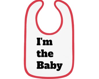 I'M THE BABY Jersey slabbetje voor baby's met contrasterende afwerking