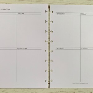 May include: A weekly planner with a white background and black text. The planner is divided into seven sections for each day of the week, with a notes section at the top. The text "Week commencing:" is at the top of the planner.