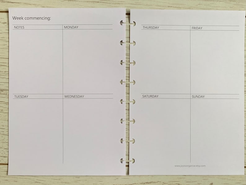 May include: A weekly planner with a white background and black text. The planner is divided into seven sections for each day of the week, with a notes section at the top. The text "Week commencing:" is at the top of the planner.